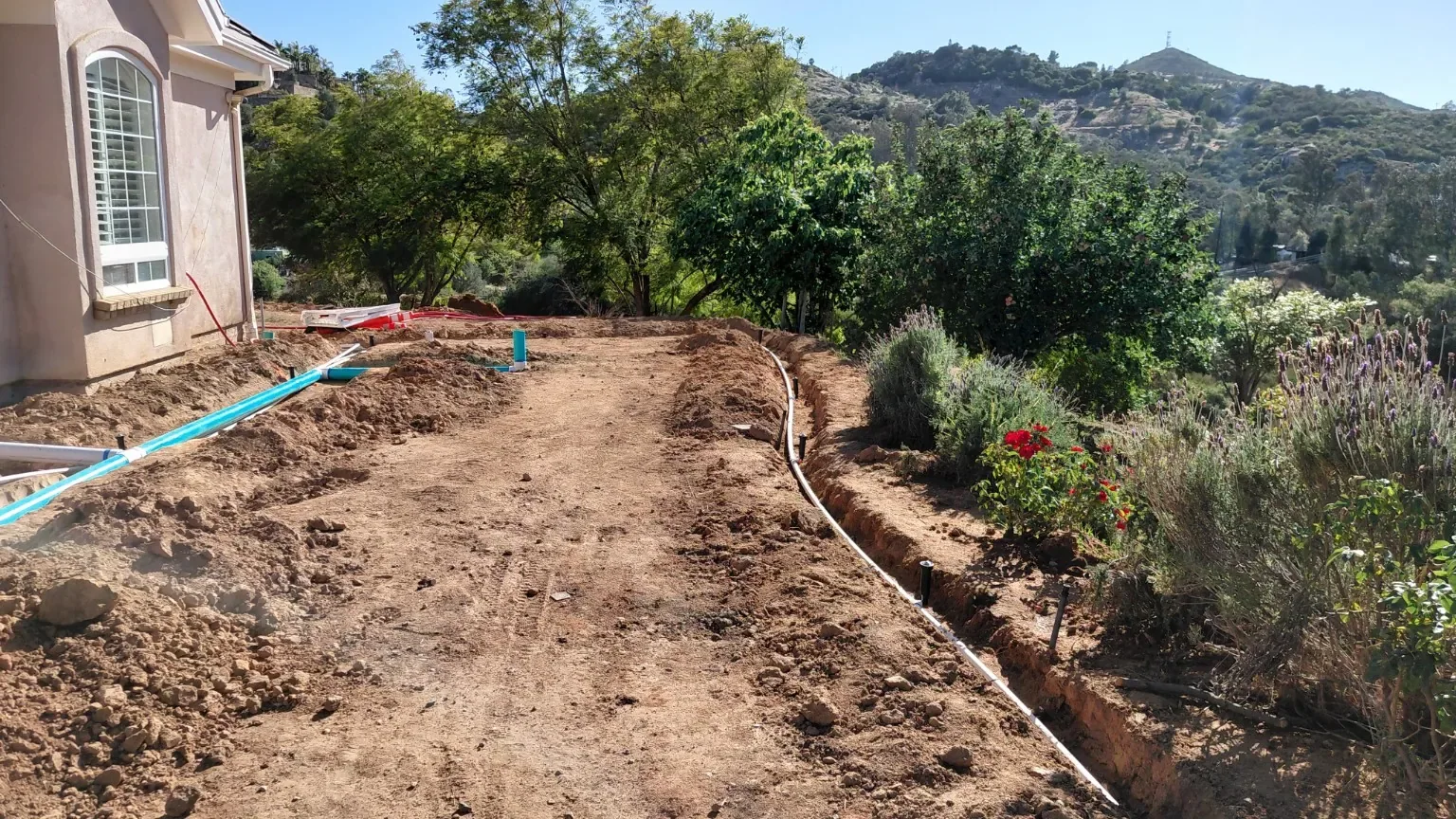 Before backfilling: An open drain trench around the perimeter of the yard.