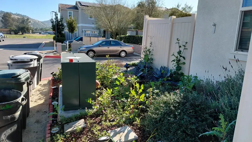 The original front planting area before the rock installation.