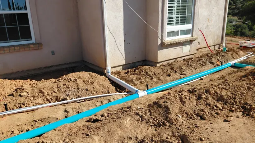 Pipework and fittings before the trenches are backfilled.