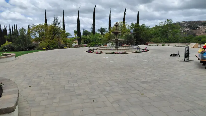 The existing paver courtyard beside the lawn installation.