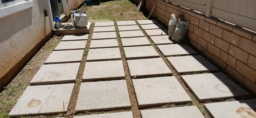 The existing square-paver walkway after weeding.